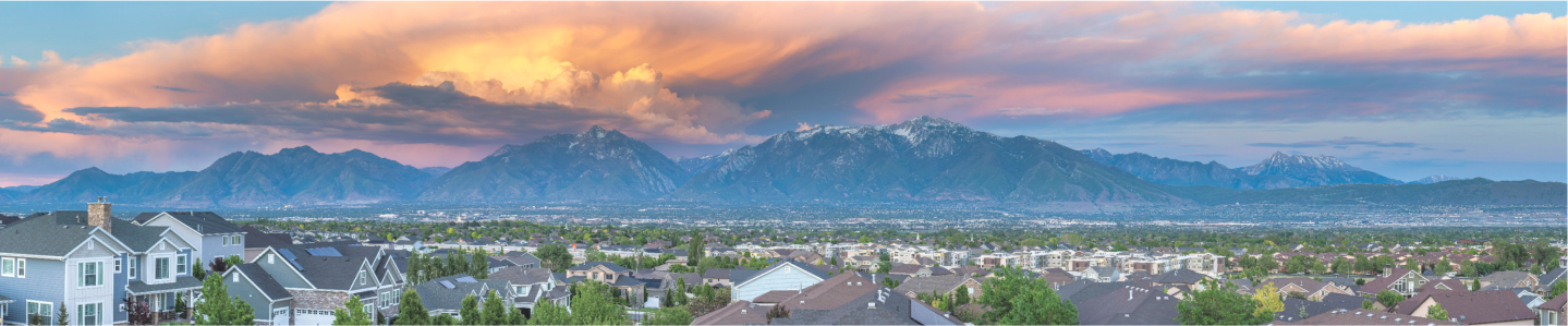 Overlooking rooftops and skyline with mountains in the background